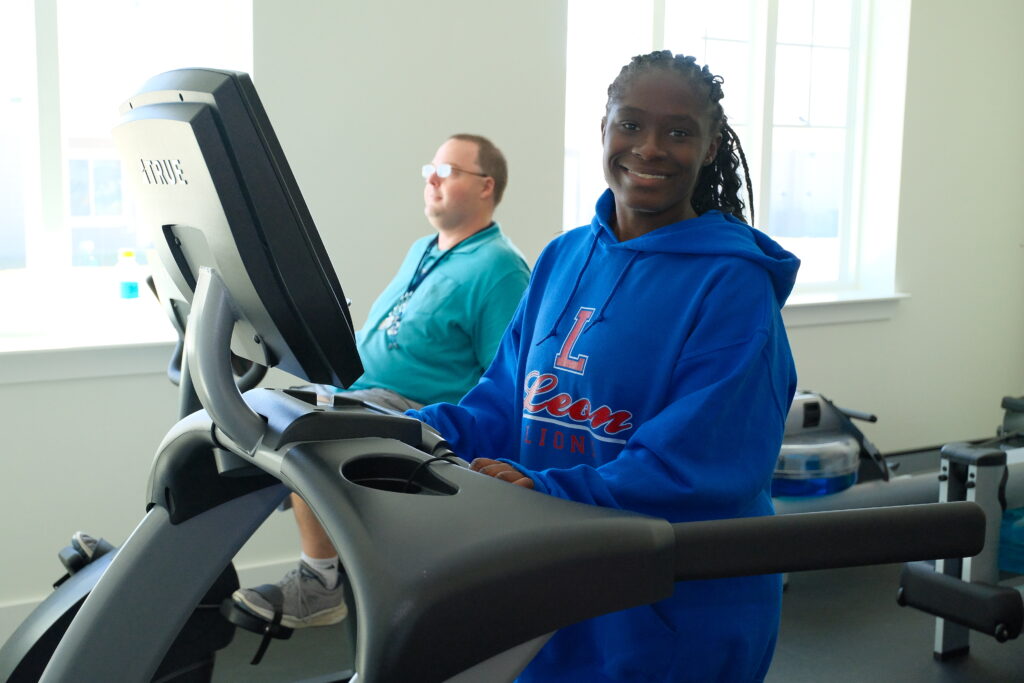 Independence Landing - Resident running in the gyms facility threadmill