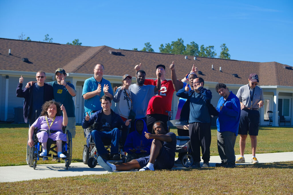 Independence Landing - Happy Residents posing for a group picture showing thumbs up
